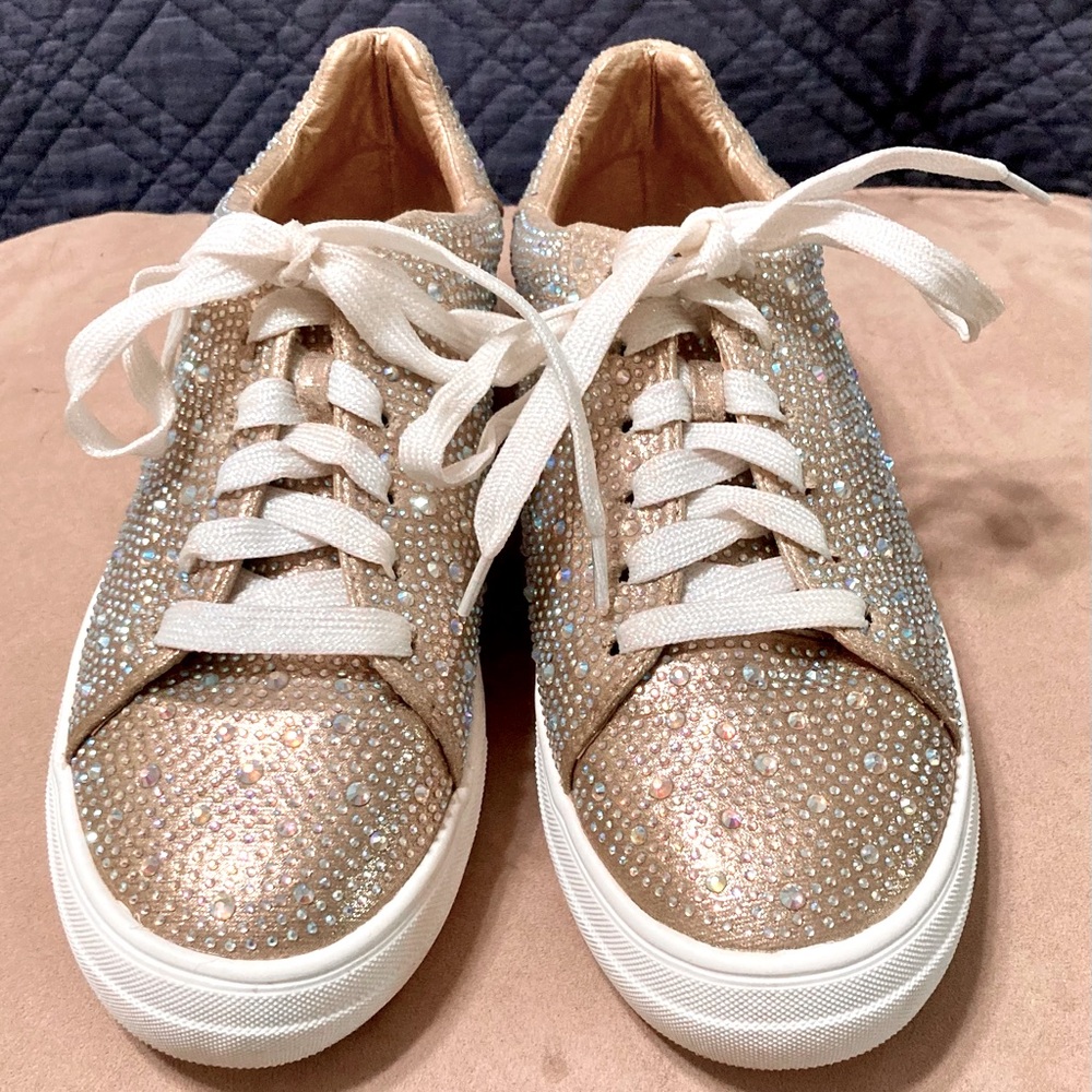 Rhinestone sneakers with a 1.5 inch heel and glitter laces.